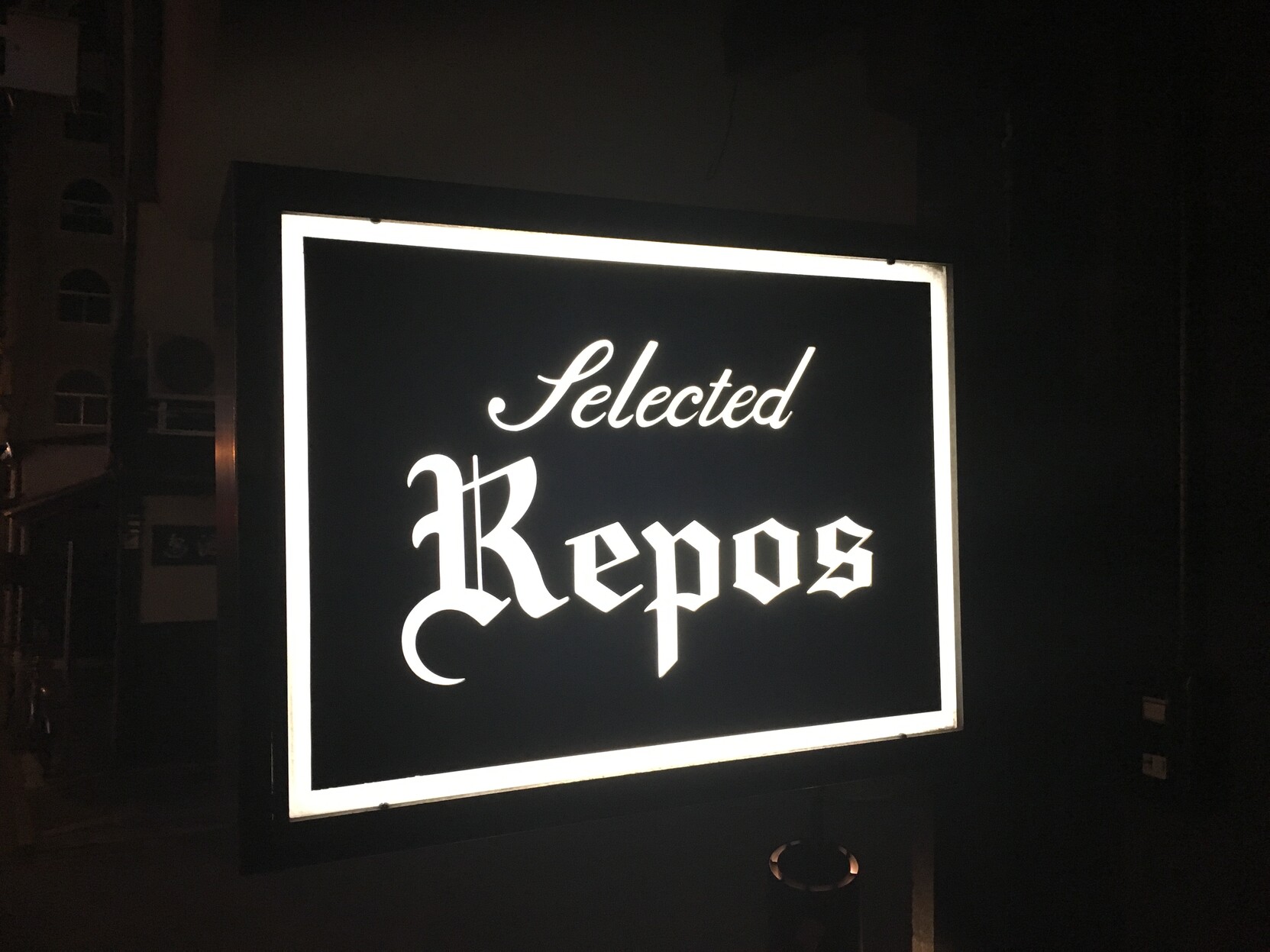 Photo of a restaurant sign in Japan that says “selected repos”