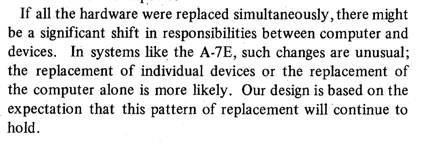 A photo of a printed document with text discussing hardware replacement and design expectations within computer systems.