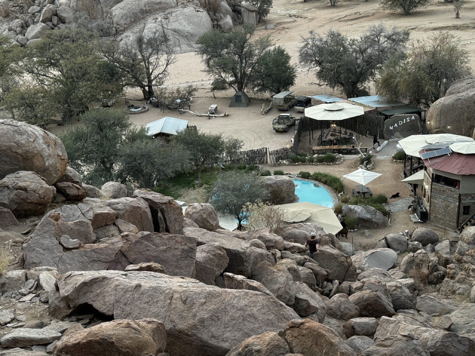 Madisa Camp from the boulders above, with the pool and campsites below